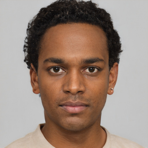 Neutral black young-adult male with short  black hair and brown eyes