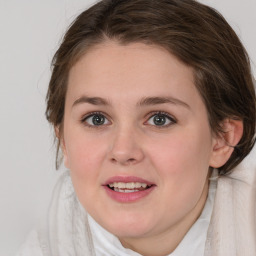 Joyful white young-adult female with medium  brown hair and blue eyes