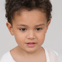 Joyful white child female with short  brown hair and brown eyes