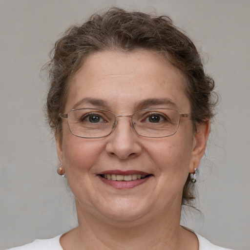 Joyful white adult female with short  brown hair and brown eyes