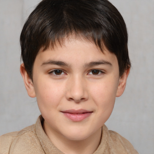 Joyful white child male with short  brown hair and brown eyes
