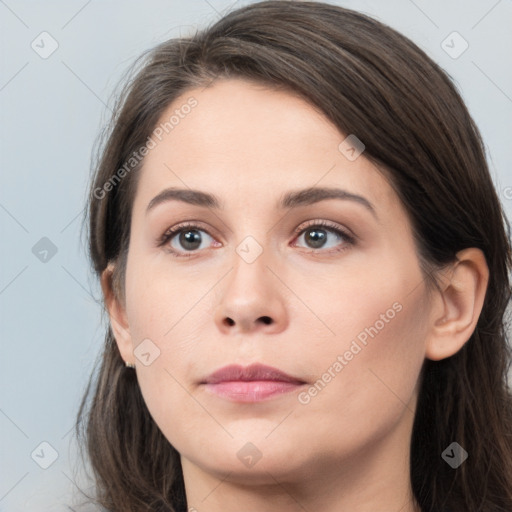 Neutral white young-adult female with long  brown hair and brown eyes