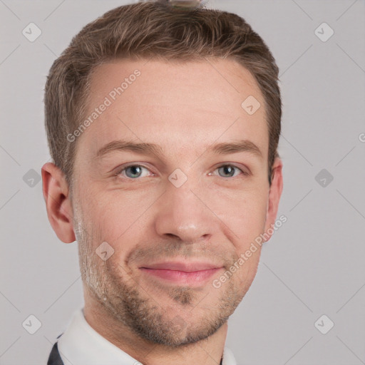 Joyful white young-adult male with short  brown hair and grey eyes