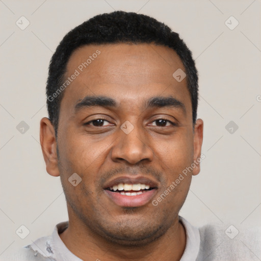 Joyful black young-adult male with short  black hair and brown eyes
