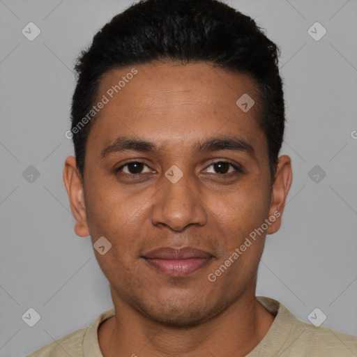Joyful black young-adult male with short  black hair and brown eyes