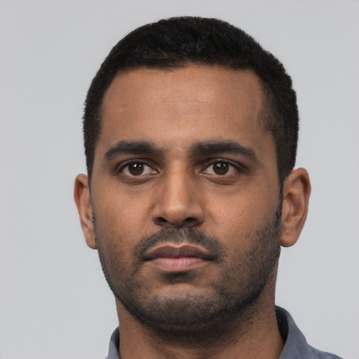 Neutral black young-adult male with short  black hair and brown eyes