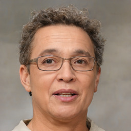 Joyful white middle-aged male with short  brown hair and brown eyes