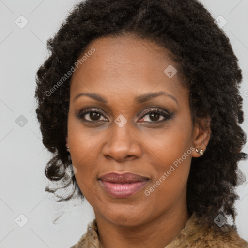 Joyful black adult female with medium  brown hair and brown eyes