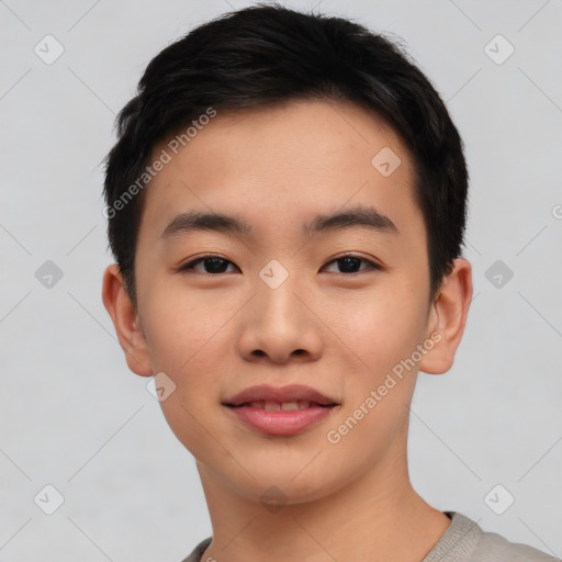 Joyful asian young-adult male with short  black hair and brown eyes