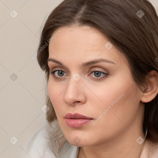 Neutral white young-adult female with medium  brown hair and brown eyes