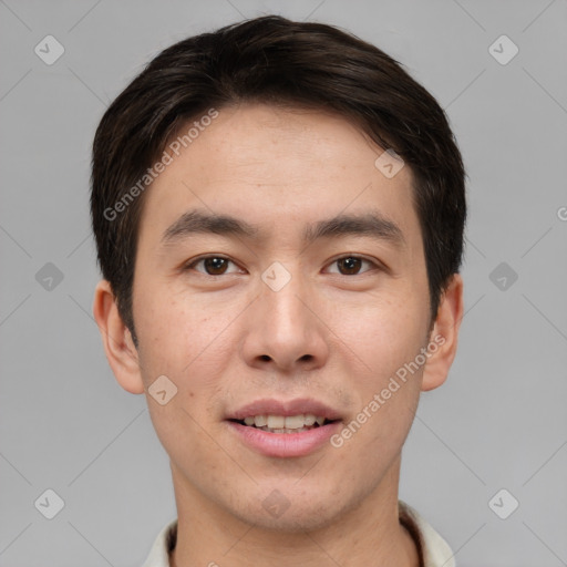 Joyful asian young-adult male with short  brown hair and brown eyes