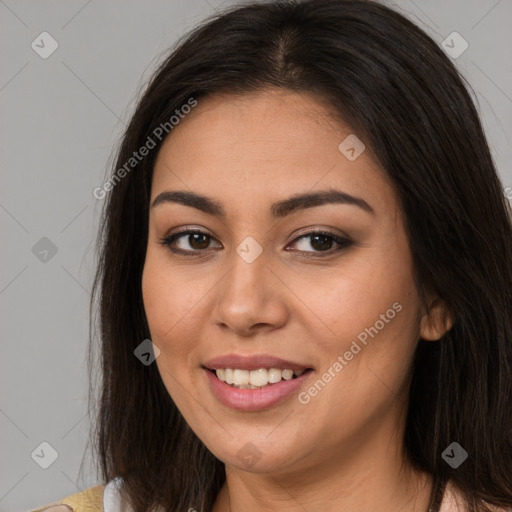 Joyful asian young-adult female with long  brown hair and brown eyes