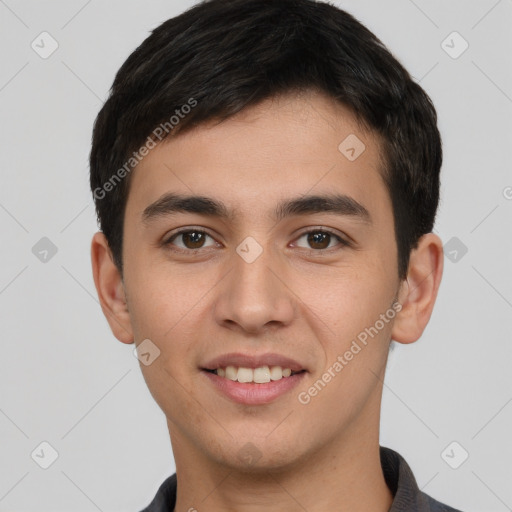 Joyful white young-adult male with short  black hair and brown eyes