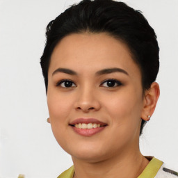 Joyful asian young-adult female with short  black hair and brown eyes