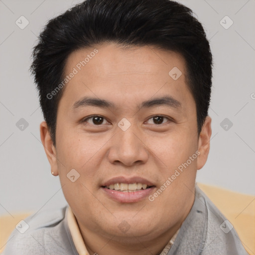 Joyful asian young-adult male with short  brown hair and brown eyes