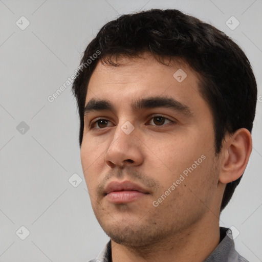 Neutral white young-adult male with short  black hair and brown eyes