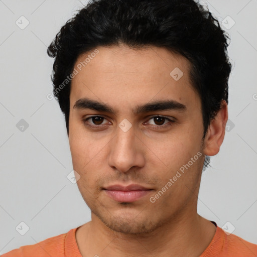 Neutral latino young-adult male with short  black hair and brown eyes