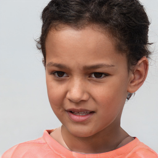 Joyful white child male with short  brown hair and brown eyes