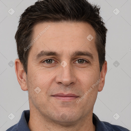 Joyful white adult male with short  brown hair and brown eyes