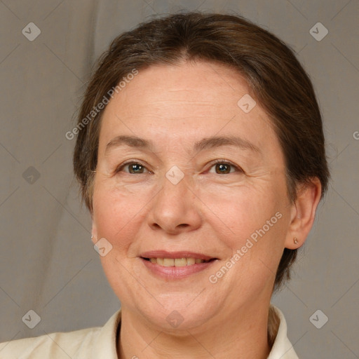 Joyful white adult female with medium  brown hair and brown eyes