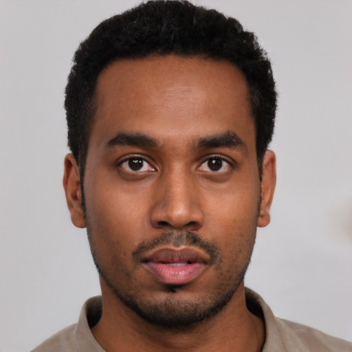 Neutral black young-adult male with short  black hair and brown eyes