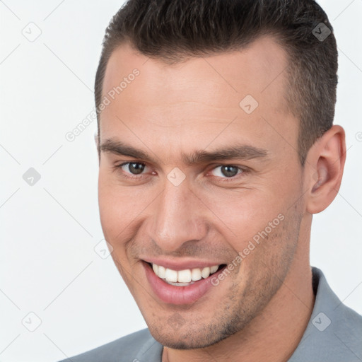 Joyful white young-adult male with short  brown hair and brown eyes