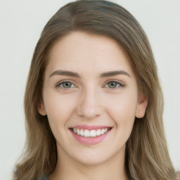 Joyful white young-adult female with long  brown hair and green eyes