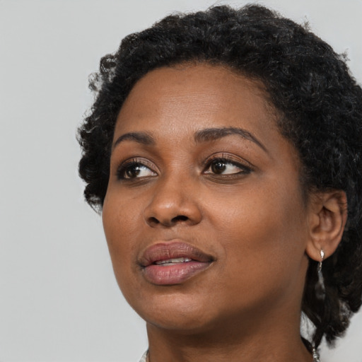 Neutral black young-adult female with short  black hair and brown eyes