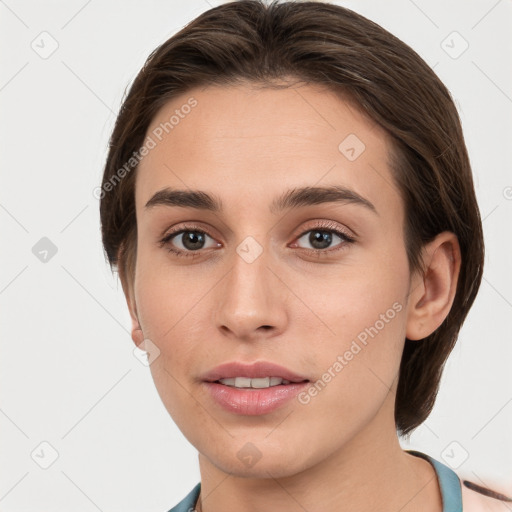 Joyful white young-adult female with medium  brown hair and grey eyes