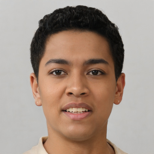 Joyful latino young-adult male with short  black hair and brown eyes