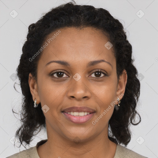 Joyful black young-adult female with medium  brown hair and brown eyes