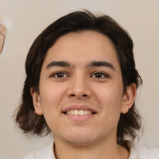 Joyful white young-adult male with medium  brown hair and brown eyes