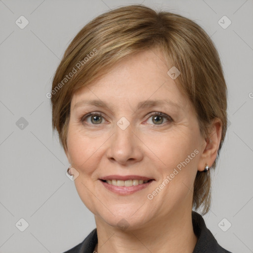 Joyful white adult female with medium  brown hair and grey eyes