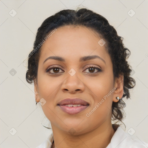 Joyful black young-adult female with medium  brown hair and brown eyes