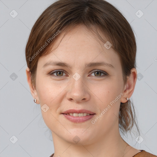 Joyful white young-adult female with medium  brown hair and grey eyes