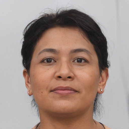 Joyful asian adult female with short  brown hair and brown eyes