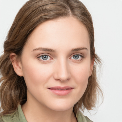 Joyful white young-adult female with medium  brown hair and blue eyes