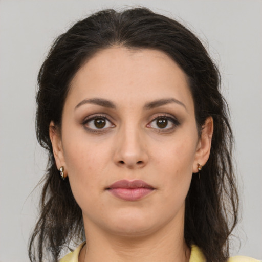 Neutral white young-adult female with medium  brown hair and brown eyes