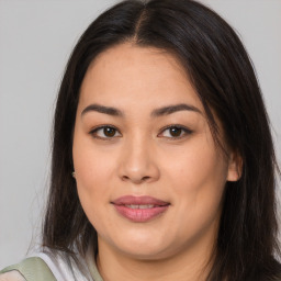 Joyful asian young-adult female with long  brown hair and brown eyes