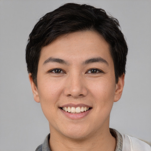 Joyful white young-adult female with short  black hair and brown eyes