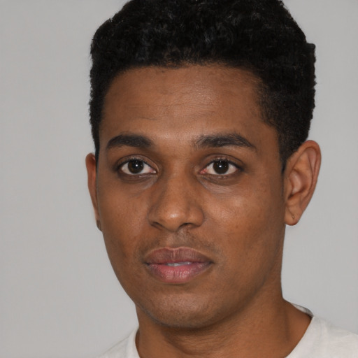 Neutral black young-adult male with short  black hair and brown eyes