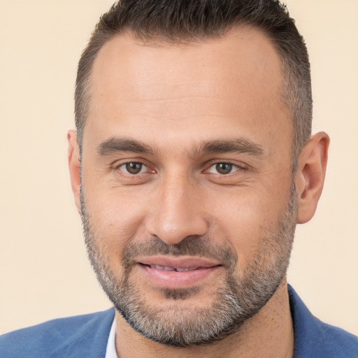 Joyful white adult male with short  brown hair and brown eyes