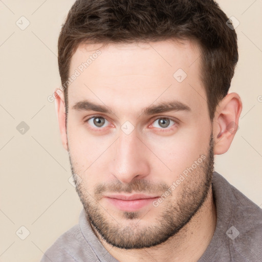 Neutral white young-adult male with short  brown hair and brown eyes