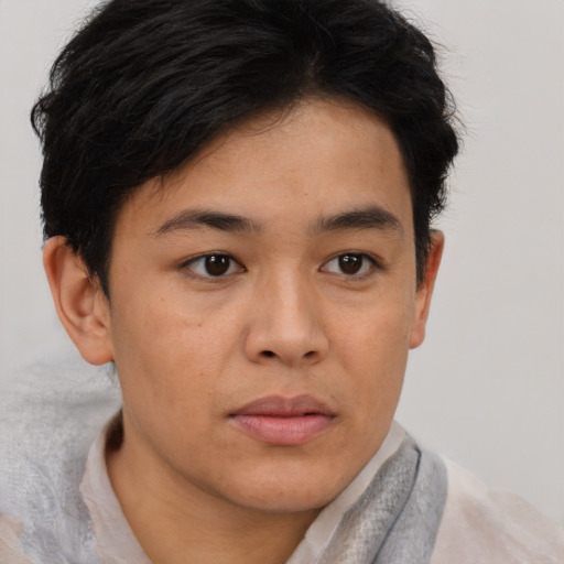 Joyful asian young-adult male with short  brown hair and brown eyes