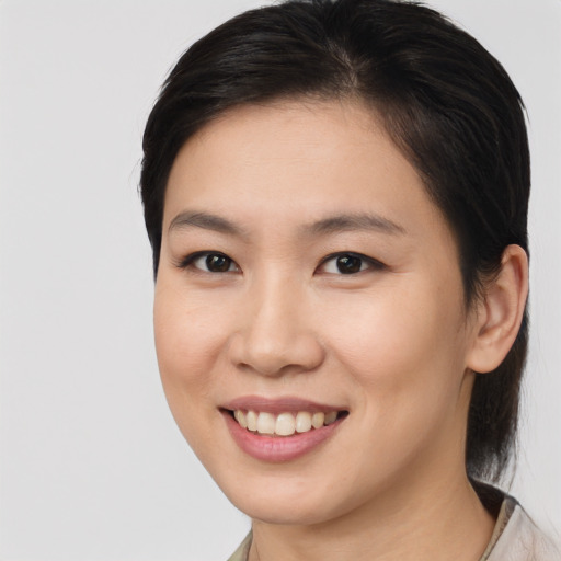Joyful white young-adult female with medium  brown hair and brown eyes
