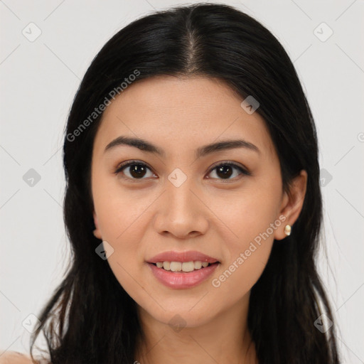 Joyful asian young-adult female with long  brown hair and brown eyes