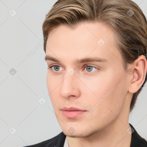 Neutral white young-adult male with short  brown hair and grey eyes