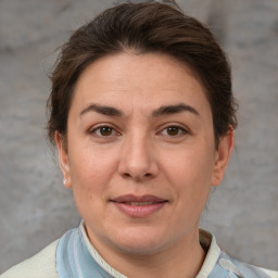 Joyful white adult female with short  brown hair and brown eyes