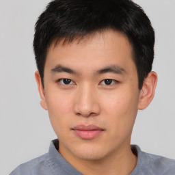 Neutral asian young-adult male with short  brown hair and brown eyes