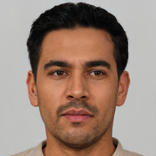 Neutral latino young-adult male with short  black hair and brown eyes